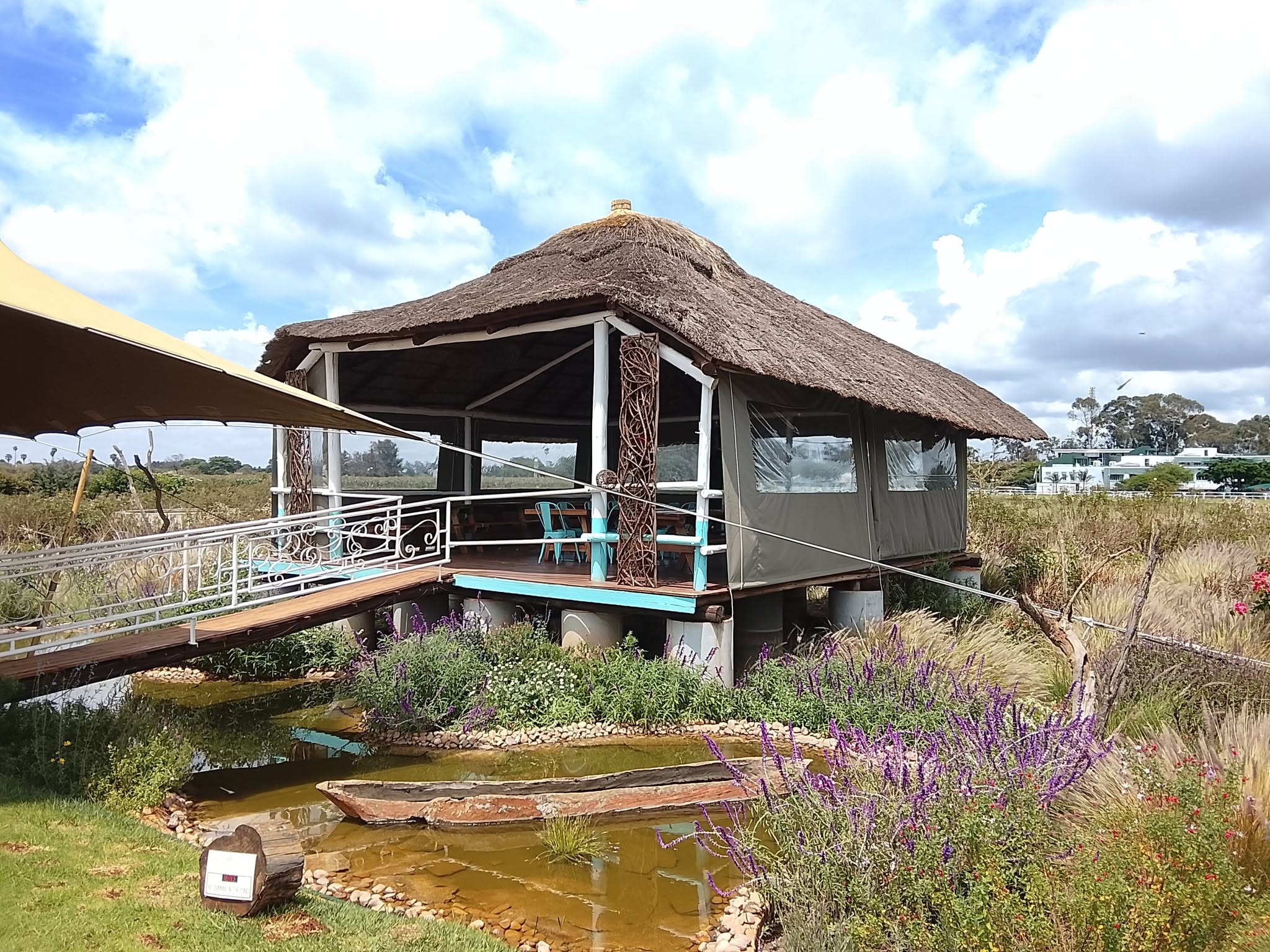 Safari lapa with canvas blinds and shade sail